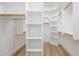 Walk-in closet with built-in shelving, providing ample storage space and organization at 4266 E Blue Sage Ct, Gilbert, AZ 85297