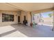 The covered patio features concrete flooring, offering a seamless transition from indoor to outdoor living at 43727 W Wade Dr, Maricopa, AZ 85138