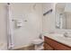 Bathroom with standard tub, sink, and toilet, featuring neutral tile and lighting at 45539 W Long Way, Maricopa, AZ 85139