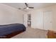 Spacious bedroom with carpet features a walk-in closet and standard closet for ample storage space at 45539 W Long Way, Maricopa, AZ 85139