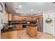 Well-equipped kitchen with granite counters, stainless steel appliances, and a convenient center island at 45539 W Long Way, Maricopa, AZ 85139