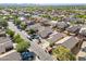 Aerial view of a residential neighborhood with well-maintained homes and tree-lined streets at 4642 E Sierrita Rd, San Tan Valley, AZ 85143