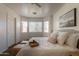Bright bedroom showcasing large windows, a comfortable bed, and stylish accents, creating a serene retreat at 4642 E Sierrita Rd, San Tan Valley, AZ 85143