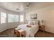 Bright primary bedroom with windows, a tray, and neutral decor at 4642 E Sierrita Rd, San Tan Valley, AZ 85143