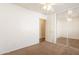 Bedroom showcasing mirrored closet doors, a ceiling fan, and ample space at 4642 E Sierrita Rd, San Tan Valley, AZ 85143