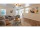 Open-concept living area with neutral tones, a view into the kitchen, and modern furnishings at 4642 E Sierrita Rd, San Tan Valley, AZ 85143