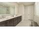 Elegant bathroom with double vanity, modern fixtures, and tiled walk-in shower offering a spa-like experience at 5109 E Helena Dr, Scottsdale, AZ 85254