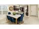 Bright dining room with stylish table set, seamlessly connecting to the modern kitchen at 5109 E Helena Dr, Scottsdale, AZ 85254