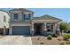 Charming two-story home with a well-manicured front yard and a gray exterior paint at 5109 E Helena Dr, Scottsdale, AZ 85254