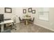 Bright home office features a modern desk, comfortable seating, and a cozy round table at 5109 E Helena Dr, Scottsdale, AZ 85254