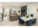 Open-concept layout showcasing the living room and dining area with natural light and modern decor at 5109 E Helena Dr, Scottsdale, AZ 85254