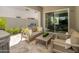 Inviting outdoor patio area with comfortable seating and a built-in barbecue grill at 5109 E Helena Dr, Scottsdale, AZ 85254