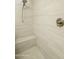 Spa-like shower showcases elegant tile work, a built-in bench, and a rainfall shower head at 5109 E Helena Dr, Scottsdale, AZ 85254