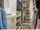 Spacious walk-in closet featuring ample shelving, rods, and storage space for shoes and accessories at 5109 E Helena Dr, Scottsdale, AZ 85254