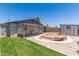 Spacious backyard featuring a patio area, storage shed, and well-maintained lawn at 5243 W Vernon Ave, Phoenix, AZ 85035