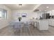 Dining room and kitchen featuring modern cabinetry and stainless steel appliances at 5243 W Vernon Ave, Phoenix, AZ 85035