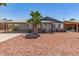 Charming single-story home with desert landscaping and a covered carport at 5243 W Vernon Ave, Phoenix, AZ 85035