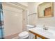 Bathroom with shower, white tile and vanity at 6430 W Thomas Rd, Phoenix, AZ 85033