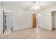 Bedroom with tile flooring and attached bathroom at 6430 W Thomas Rd, Phoenix, AZ 85033