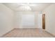 Bedroom with window, tile flooring and ceiling fan at 6430 W Thomas Rd, Phoenix, AZ 85033