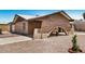 Lovely exterior of brick home showcasing unique carport arch and low-maintenance landscaping at 6430 W Thomas Rd, Phoenix, AZ 85033
