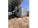 Single-story mobile home with a mature shade tree at 6439 W Myrtle Ave # 49, Glendale, AZ 85301