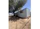 Single-story mobile home with a mature shade tree at 6439 W Myrtle Ave # 49, Glendale, AZ 85301