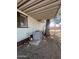 Exterior view of the home, featuring an air conditioner and a covered area at 6439 W Myrtle Ave # 49, Glendale, AZ 85301