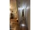 Hallway featuring wood flooring with access to rooms and ample lighting at 6439 W Myrtle Ave # 49, Glendale, AZ 85301