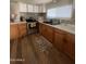 Cozy kitchen with stainless steel appliances and wooden cabinetry at 6439 W Myrtle Ave # 49, Glendale, AZ 85301