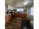 Cozy kitchen with stainless steel appliances and wooden cabinetry at 6439 W Myrtle Ave # 49, Glendale, AZ 85301