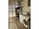Bright laundry room with washer, dryer, storage shelving, and natural light at 6439 W Myrtle Ave # 49, Glendale, AZ 85301