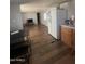 Open concept living space with hardwood floors connecting the living area to the kitchen at 6439 W Myrtle Ave # 49, Glendale, AZ 85301