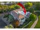 Aerial view of a multi-story home showcasing its unique architecture and beautiful landscaping at 7222 E Gainey Ranch Rd # 245, Scottsdale, AZ 85258