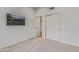 Bedroom featuring a television, closet, and ensuite bathroom at 7222 E Gainey Ranch Rd # 245, Scottsdale, AZ 85258