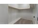 Walk-in closet with shelving and carpeted floor at 7222 E Gainey Ranch Rd # 245, Scottsdale, AZ 85258