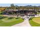 Beautiful clubhouse surrounded by palm trees and manicured golf course, perfect for leisure and recreation at 7222 E Gainey Ranch Rd # 245, Scottsdale, AZ 85258