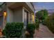 Cozy entrance featuring a neutral front door, trimmed bushes, and a clean walkway to the unit at 7222 E Gainey Ranch Rd # 245, Scottsdale, AZ 85258
