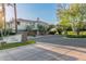 Charming home exterior with landscaped entrance and blooming trees; experience the perfect blend of style and serenity at 7222 E Gainey Ranch Rd # 245, Scottsdale, AZ 85258