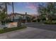 Inviting exterior view of a contemporary townhome with lush landscaping and a beautiful desert setting at 7222 E Gainey Ranch Rd # 245, Scottsdale, AZ 85258