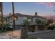 Inviting exterior with manicured landscaping and blooming trees; experience the perfect blend of style and serenity at 7222 E Gainey Ranch Rd # 245, Scottsdale, AZ 85258