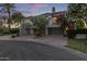 Contemporary townhomes with lush landscaping and mature trees creating a peaceful and inviting atmosphere at 7222 E Gainey Ranch Rd # 245, Scottsdale, AZ 85258