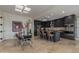 Modern kitchen with sleek, dark cabinetry, stainless steel appliances, and an adjoining dining area for gatherings at 7222 E Gainey Ranch Rd # 245, Scottsdale, AZ 85258