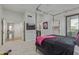 Bright main bedroom featuring a four-poster bed and access to a closet and en-suite bathroom at 7222 E Gainey Ranch Rd # 245, Scottsdale, AZ 85258