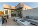 Inviting outdoor patio space with comfortable seating and a dining table, perfect for enjoying the serene surroundings at 7222 E Gainey Ranch Rd # 245, Scottsdale, AZ 85258