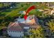 Spacious rear exterior with red tile roofing and a golf course view; a perfect blend of luxury and leisure at 7222 E Gainey Ranch Rd # 245, Scottsdale, AZ 85258