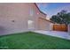 Stunning exterior side yard with lush green grass and a view of the house at 7230 W Pershing Ave, Peoria, AZ 85381