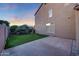 Backyard features artificial grass, a patio, and home's exterior at 7230 W Pershing Ave, Peoria, AZ 85381