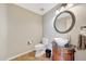 Charming powder room with unique vanity, decorative mirror, and stylish fixtures at 7230 W Pershing Ave, Peoria, AZ 85381