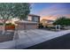Beautiful home with a three-car garage, long driveway, well-manicured landscaping, and inviting curb appeal at 7230 W Pershing Ave, Peoria, AZ 85381